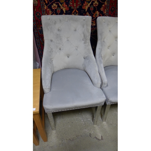 1563 - A set of four grey velvet buttoned dining chairs (two large, two standard)