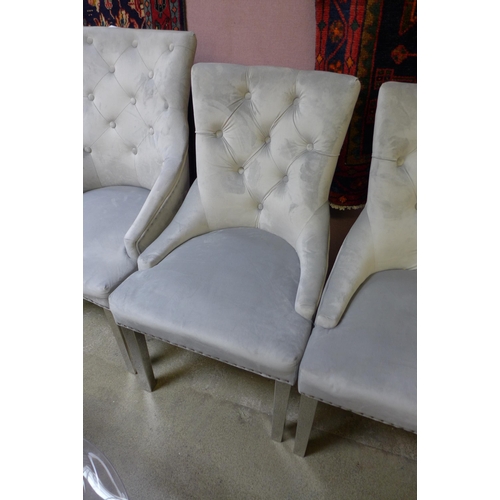 1563 - A set of four grey velvet buttoned dining chairs (two large, two standard)