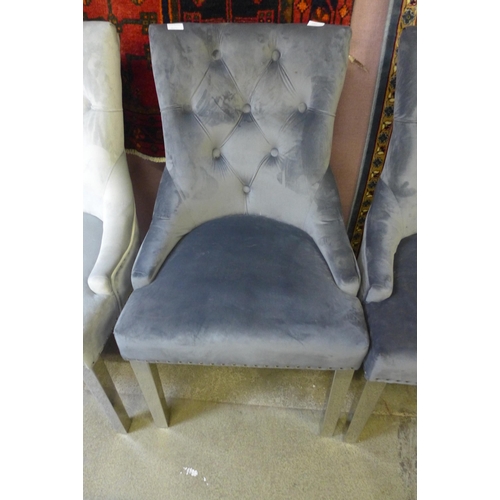 1565 - A set of four charcoal velvet dining chairs