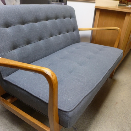 1587 - A wood framed grey upholstered two seater sofa