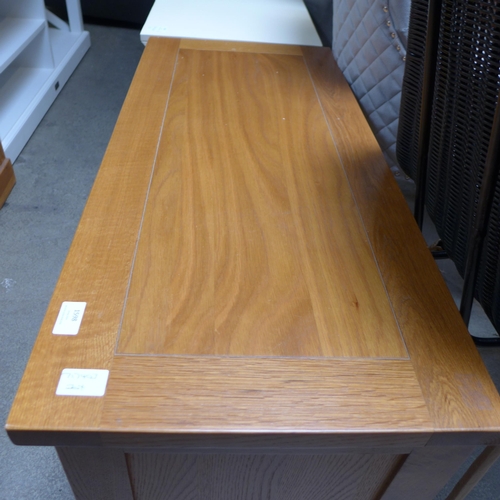 1598 - An oak single door TV unit