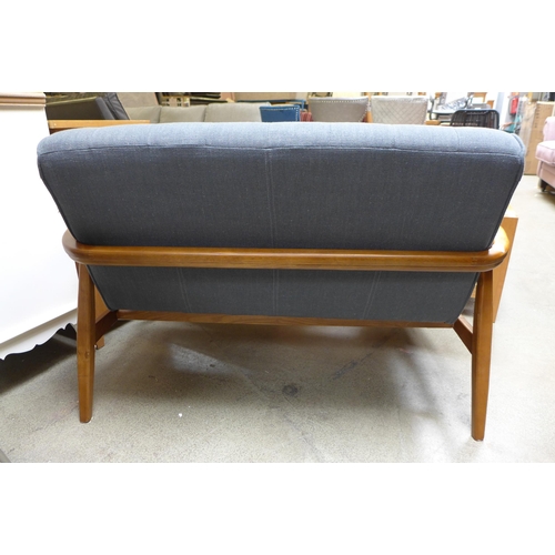 1587 - A wood framed grey upholstered two seater sofa