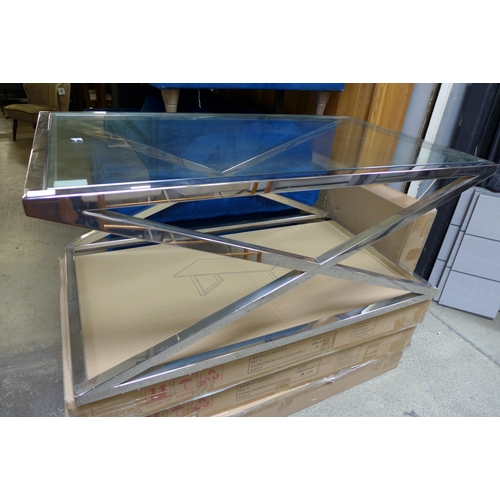 1591 - A chrome coffee table with glass top and x-frame base