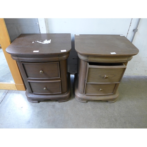 1676 - A pair of oak two drawer bedside chests (one slightly lighter)