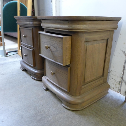 1676 - A pair of oak two drawer bedside chests (one slightly lighter)