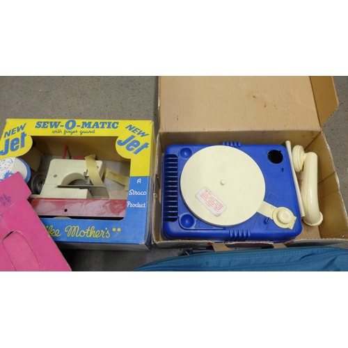 1253 - A Playcraft typewriter, Lumar toy gramophone and a Sew-O-Matic sewing machine, all boxed **PLEASE NO... 