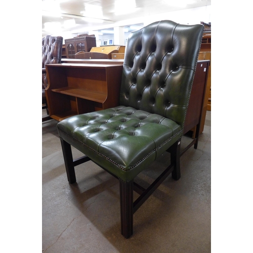 172 - A Regency style mahogany and green leather library chair