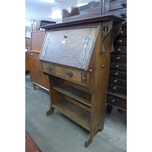 186 - An Arts and Crafts Liberty & Co. style oak students bureau