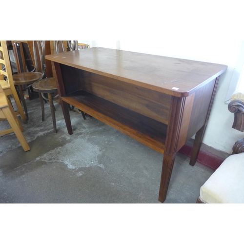 187 - A mahogany double sided open bookcase