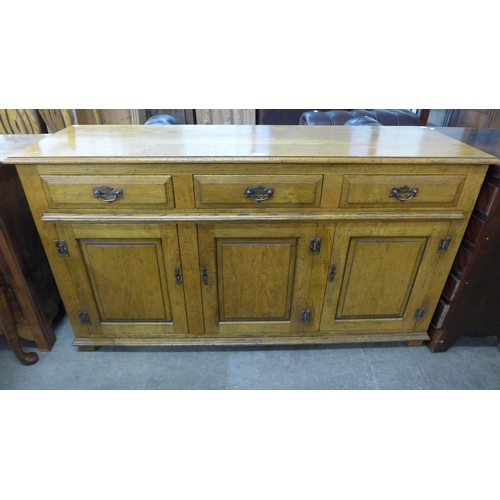 211 - A George III style elm dresser