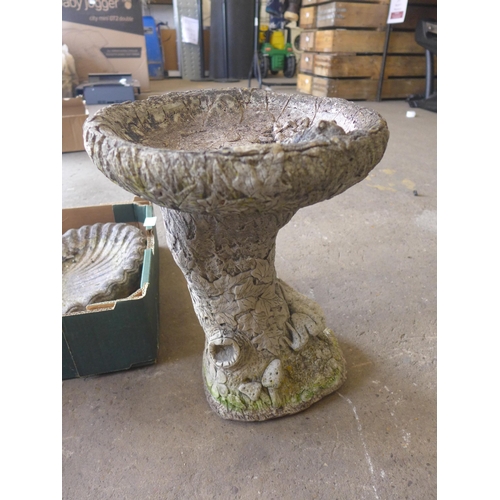 2290 - 2 Ground bird baths, one other bird bath on a stand and an assortment of garden ornaments