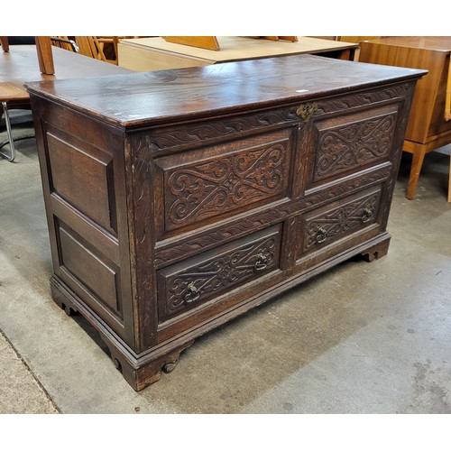 114 - A George III carved oak mule chest