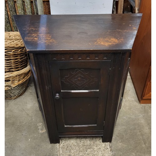 202A - A small carved oak credence cupboard