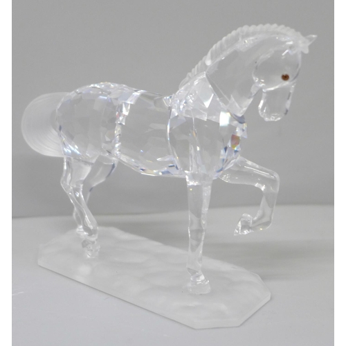 604 - A Swarovski model of a horse, boxed and with leaflet