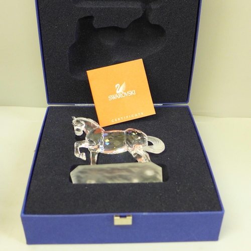 604 - A Swarovski model of a horse, boxed and with leaflet