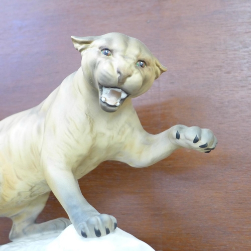 607 - A Beswick Pottery Puma On Rock matte finish designed by Arthur Gredington, 32cm