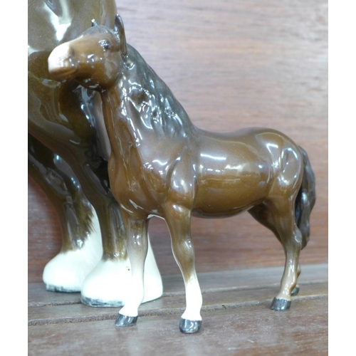 613 - A Beswick shire horse and foal, chip to ear of foal