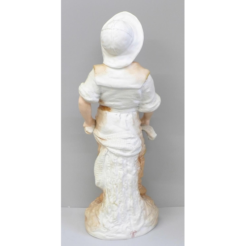 614 - A 19th Century French porcelain figure of a fisher boy, 36cm