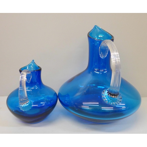 634 - Two kingfisher blue Whitefriars beak jugs, 17cm and 11cm tall