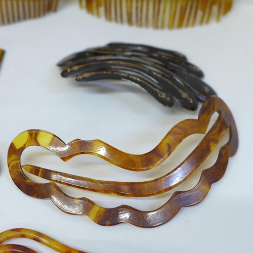 652 - A collection of hair combs and clips including horn and tortoiseshell