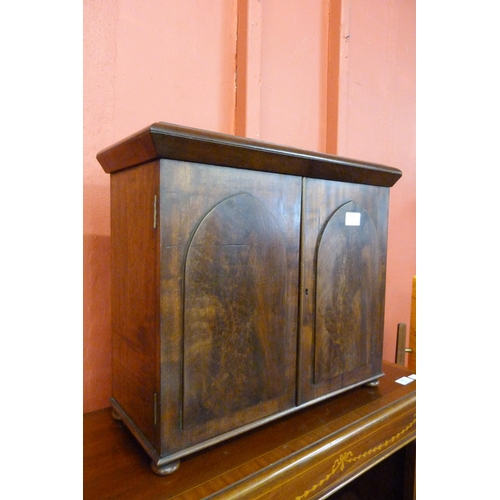 103 - A Victorian mahogany two door table top cabinet