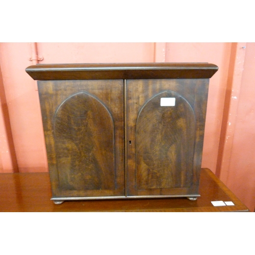 103 - A Victorian mahogany two door table top cabinet