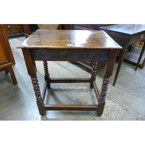 112 - A Charles II carved oak side table