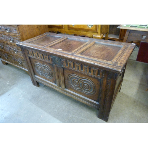 117 - A William III carved oak panelled coffer