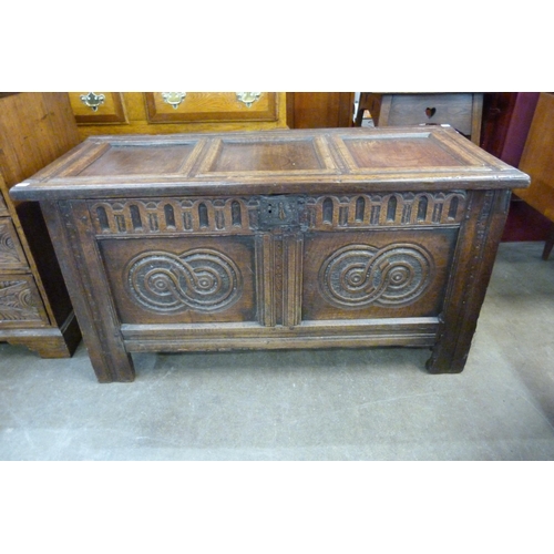 117 - A William III carved oak panelled coffer