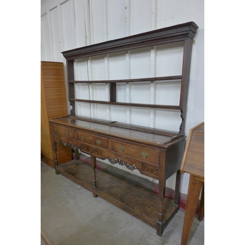 122A - A George II elm and oak dresser