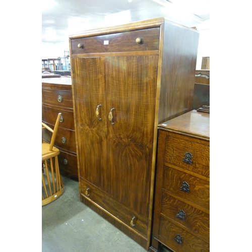 131 - An Art Deco figured walnut tallboy