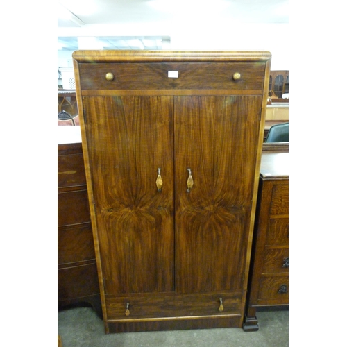 131 - An Art Deco figured walnut tallboy