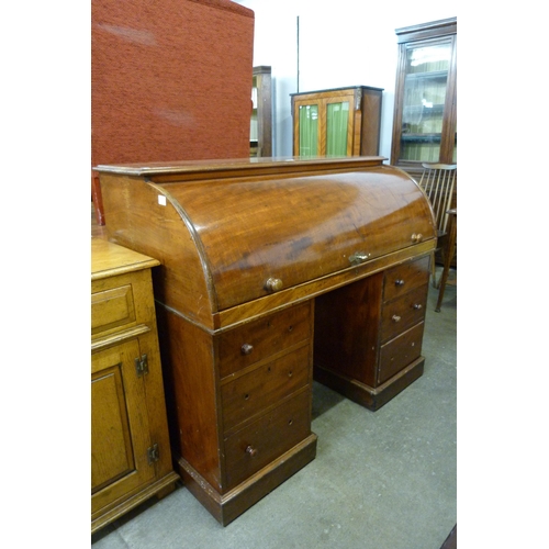 142 - A Victorian mahogany cylinder roll top desk