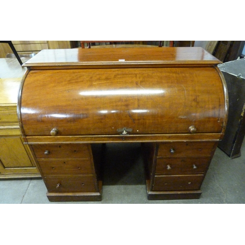 142 - A Victorian mahogany cylinder roll top desk