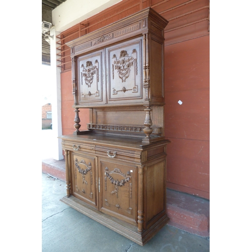 144 - A 19th Century French Henry II style carved oak side cabinet