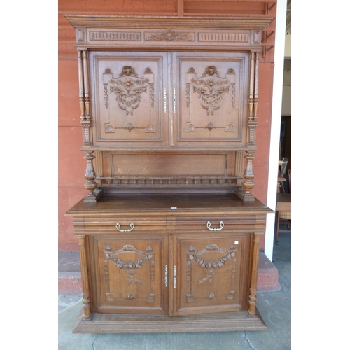 144 - A 19th Century French Henry II style carved oak side cabinet