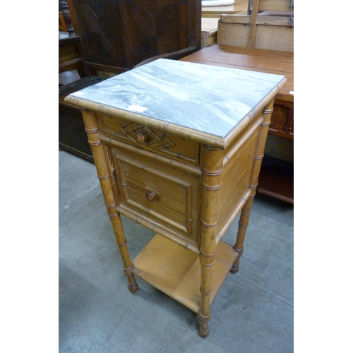 146 - A 19th Century French pine and faux marble topped table de nuit