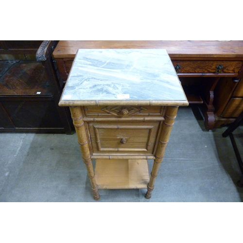 146 - A 19th Century French pine and faux marble topped table de nuit