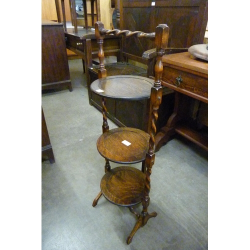 149 - An oak three tier barleytwist cake stand