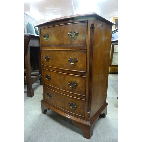 153 - A small burr walnut bow front chest of drawers