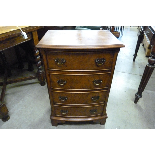 153 - A small burr walnut bow front chest of drawers