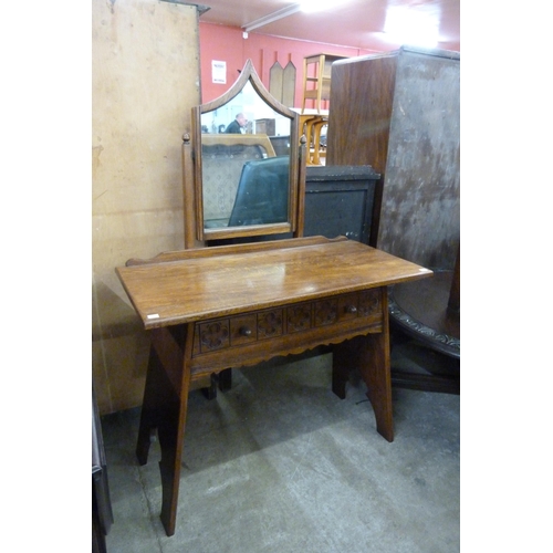 156 - A Gothic Revival carved oak dressing table