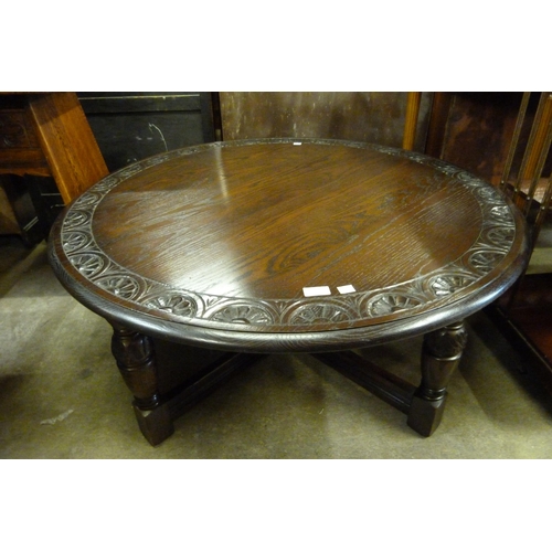 158 - A carved oak circular coffee table