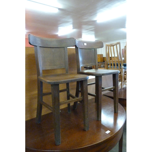 168 - A pair of Gaskel & Chambers Ltd. oak pub chairs