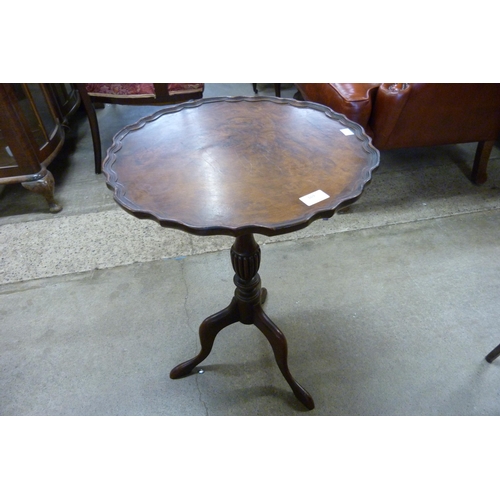 169 - A Regency style burr walnut tripod wine table