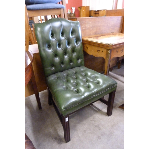 172 - A Regency style mahogany and green leather library chair