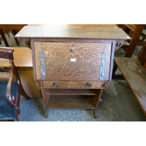 186 - An Arts and Crafts Liberty & Co. style oak students bureau