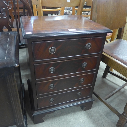 203 - A small inlaid mahogany chest of drawers