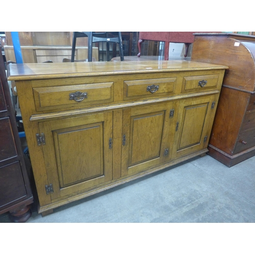 211 - A George III style elm dresser