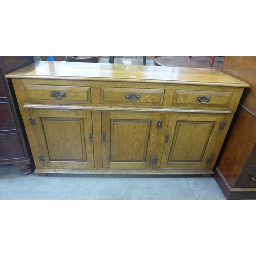 211 - A George III style elm dresser